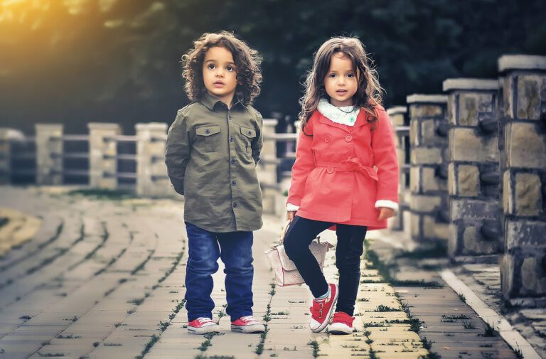 Two little kids are wearing perfectly fitted clothes